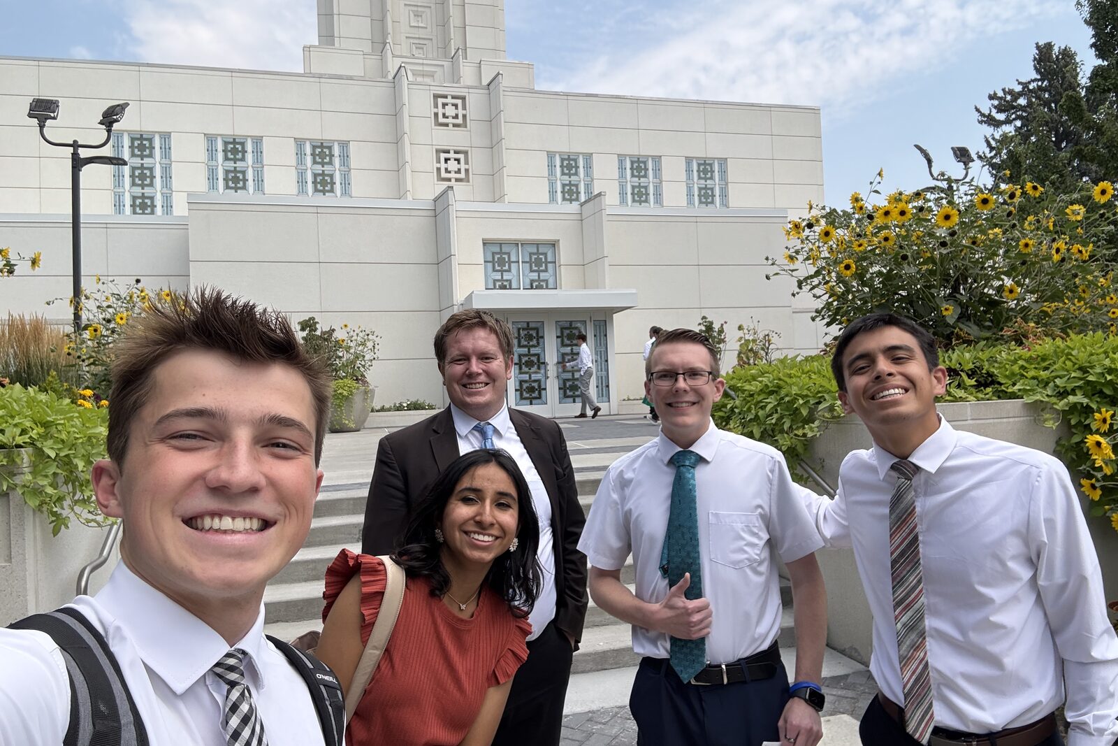 Tanner Yost and four friends in Sunday dress on the steps of the art deco Idaho Falls Idaho Temple.